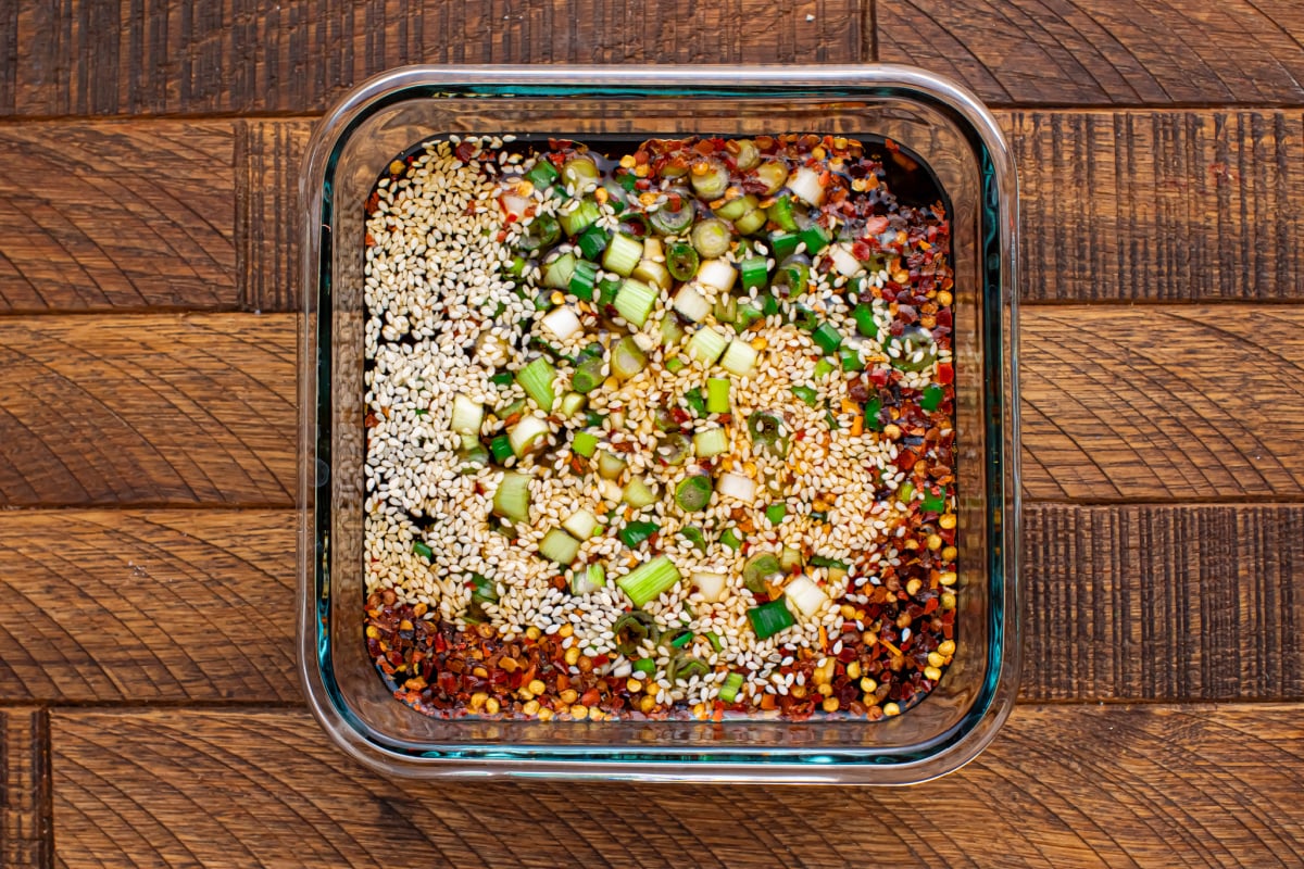 soy sauce, water, honey (or maple syrup), rice vinegar, garlic, sesame seeds, sesame oil, and chili pepper flakes in a container
