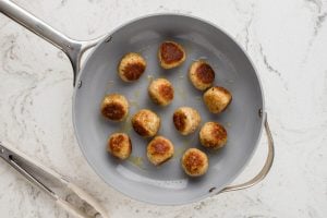 browned meatballs in a pan