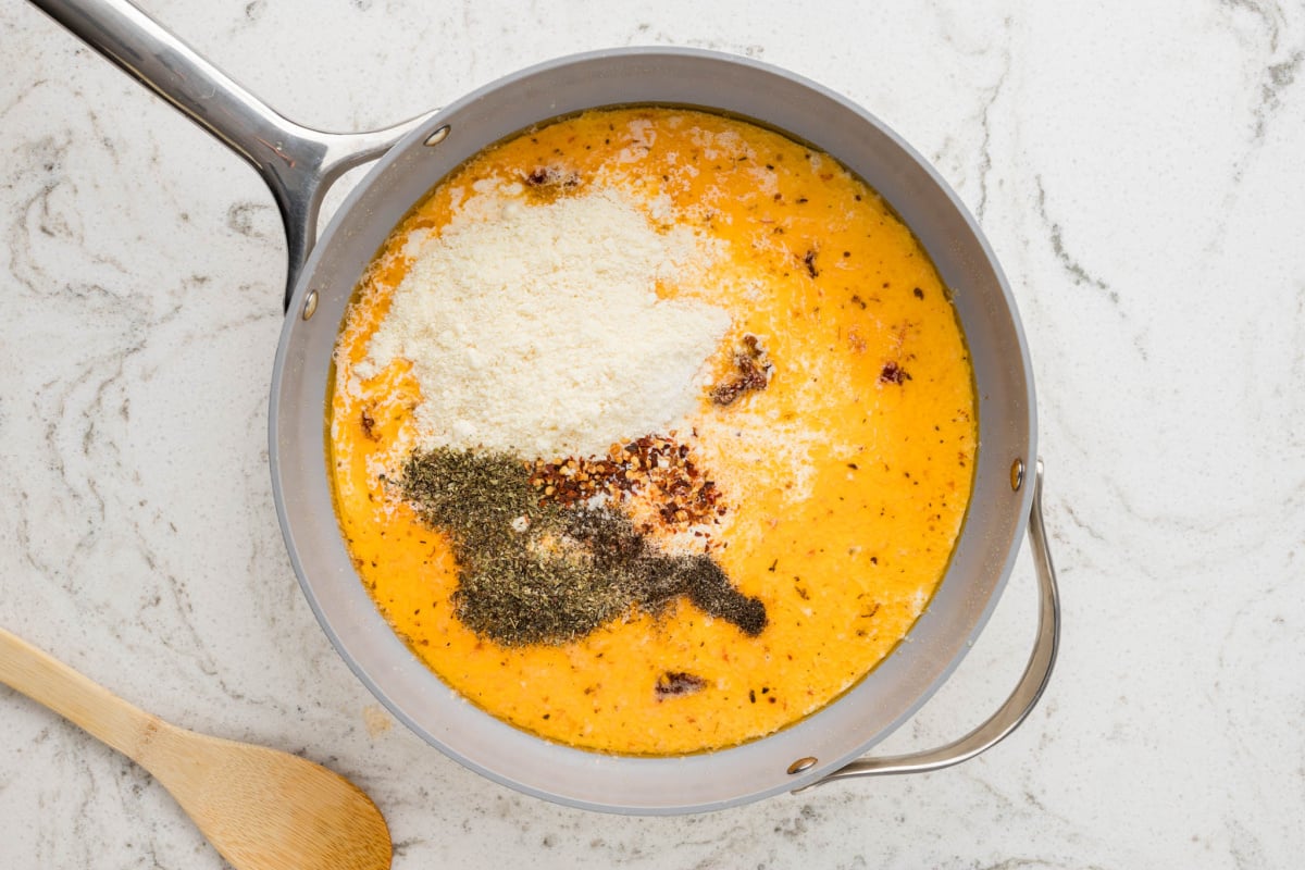 cream, parmesan cheese and seasoning added to pan