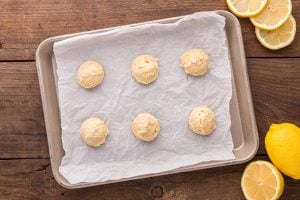 cookie dough balls on baking sheet