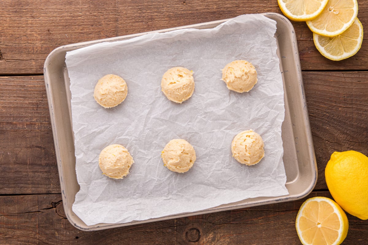 cookie dough balls on baking sheet