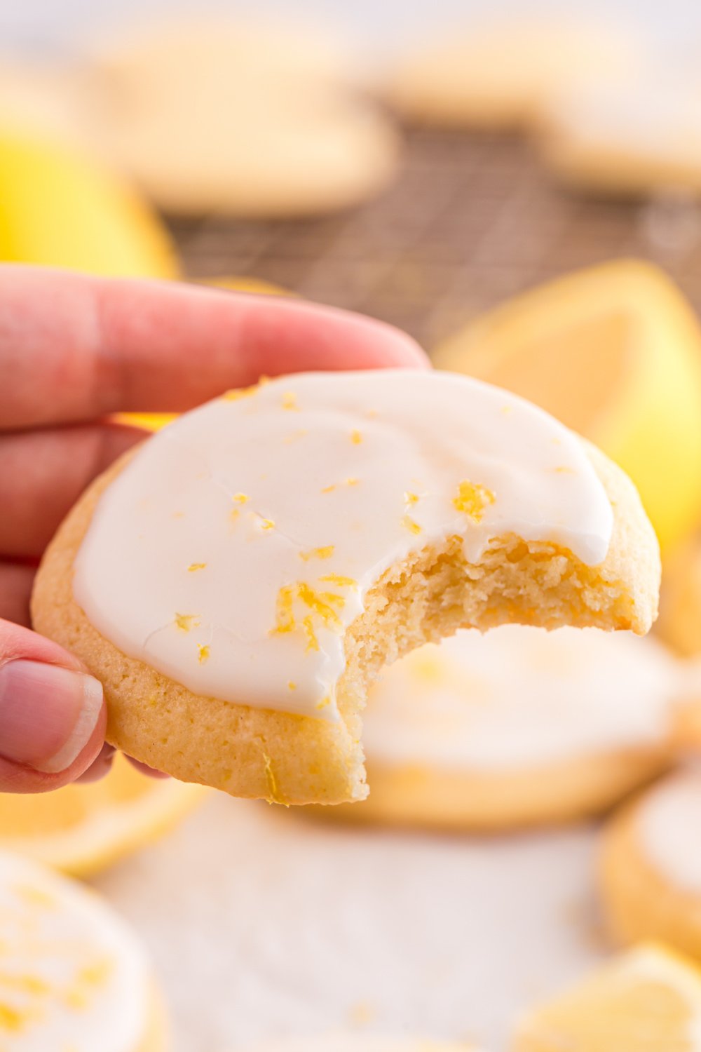 Soft and Chewy Lemon Cookies with a bite out of the cookie