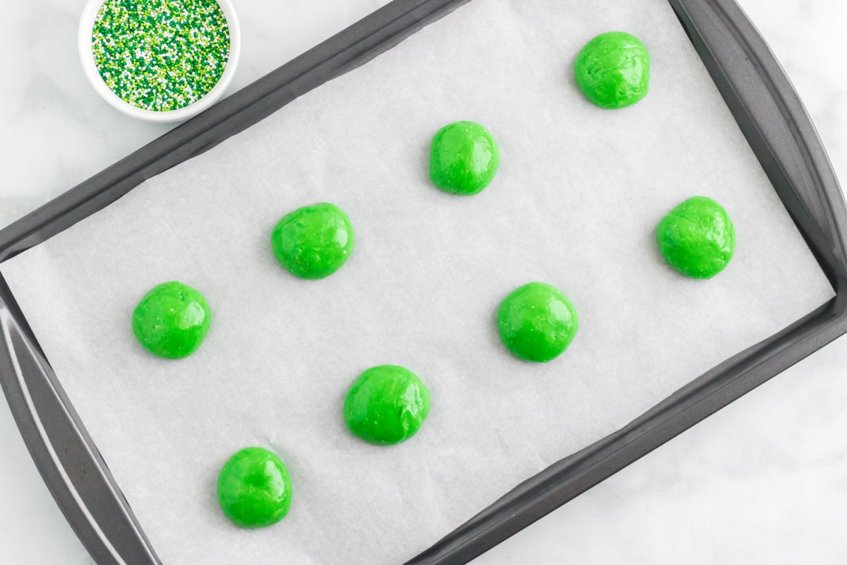 cookie balls put on a cookie sheet