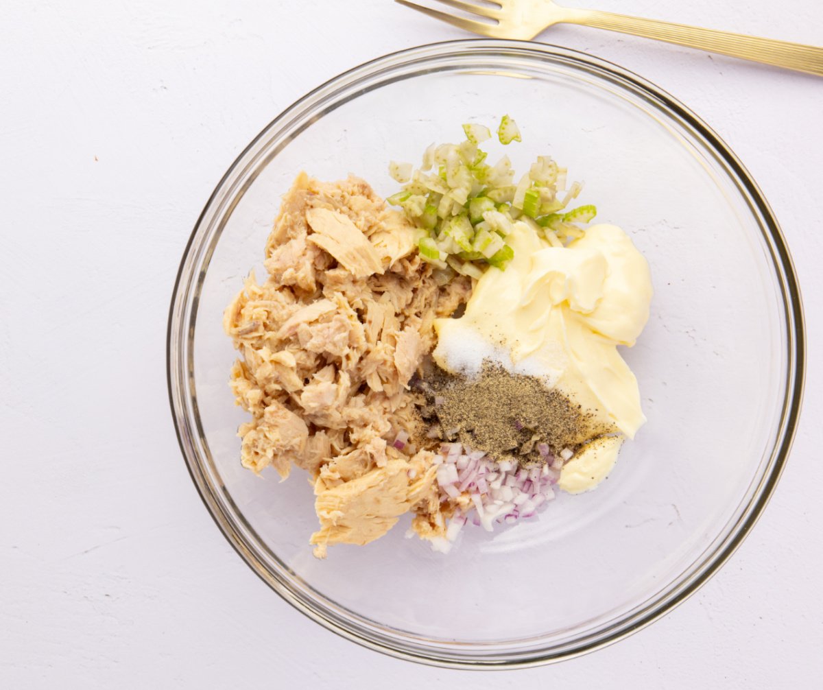 tuna, mayonnaise, celery, onion, ground pepper and salt in a bowl