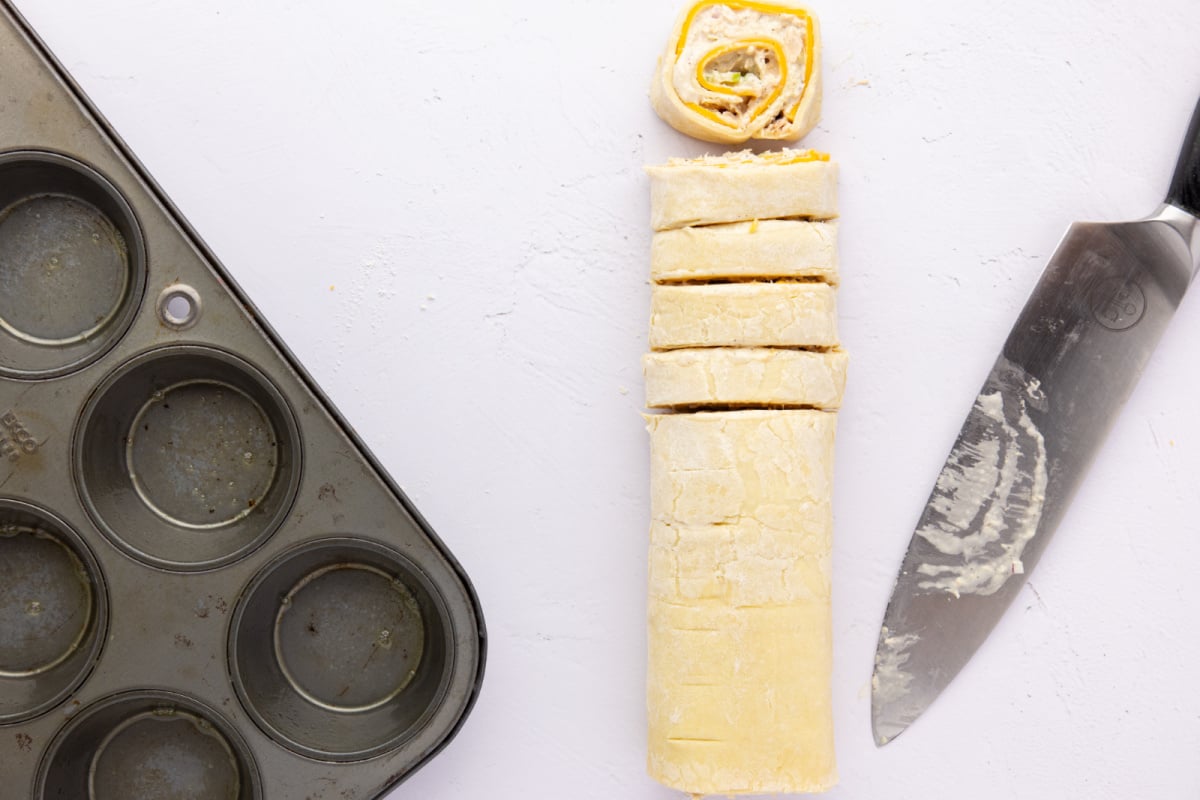 cutting sliced of puff pastry roll