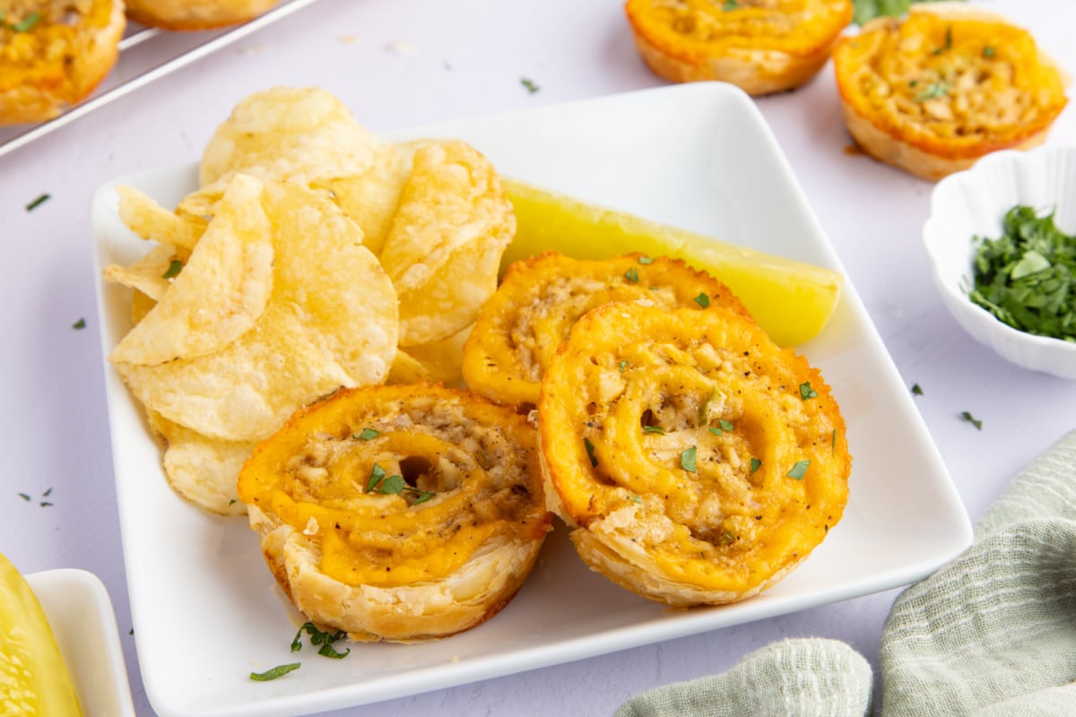 Tuna Melt Bites on a plate with chips and pickle