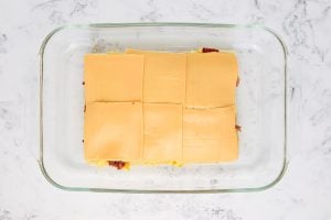 sliced cheese added on top of bacon