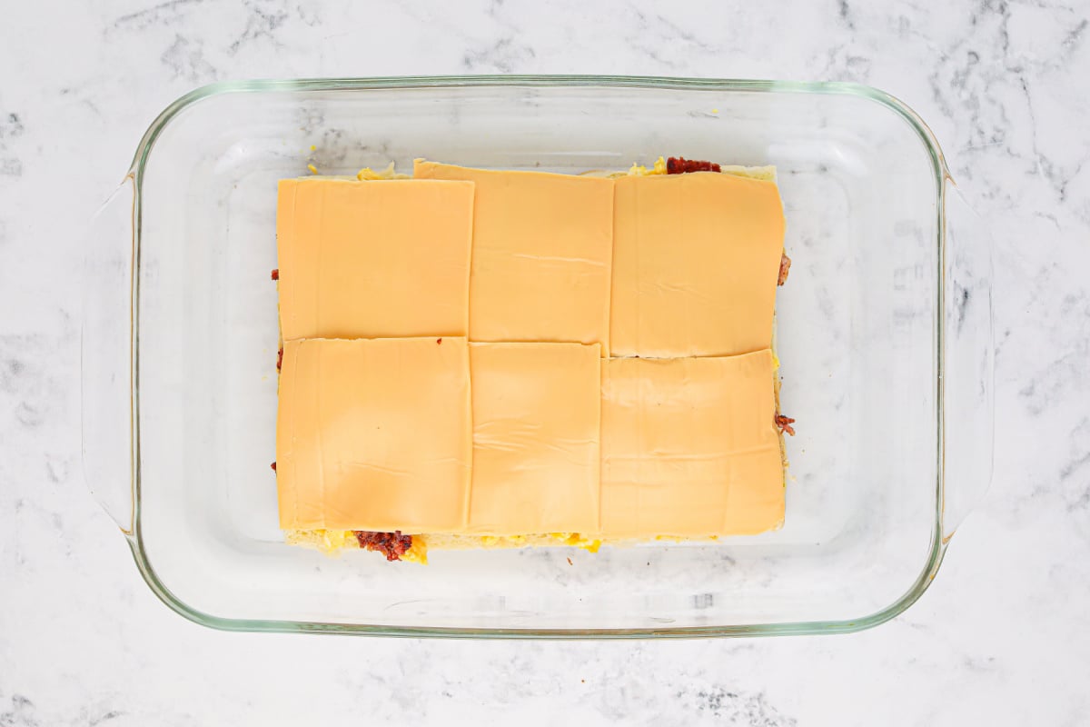 sliced cheese added on top of bacon