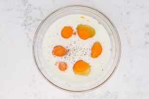 eggs, milk and salt and pepper in a bowl