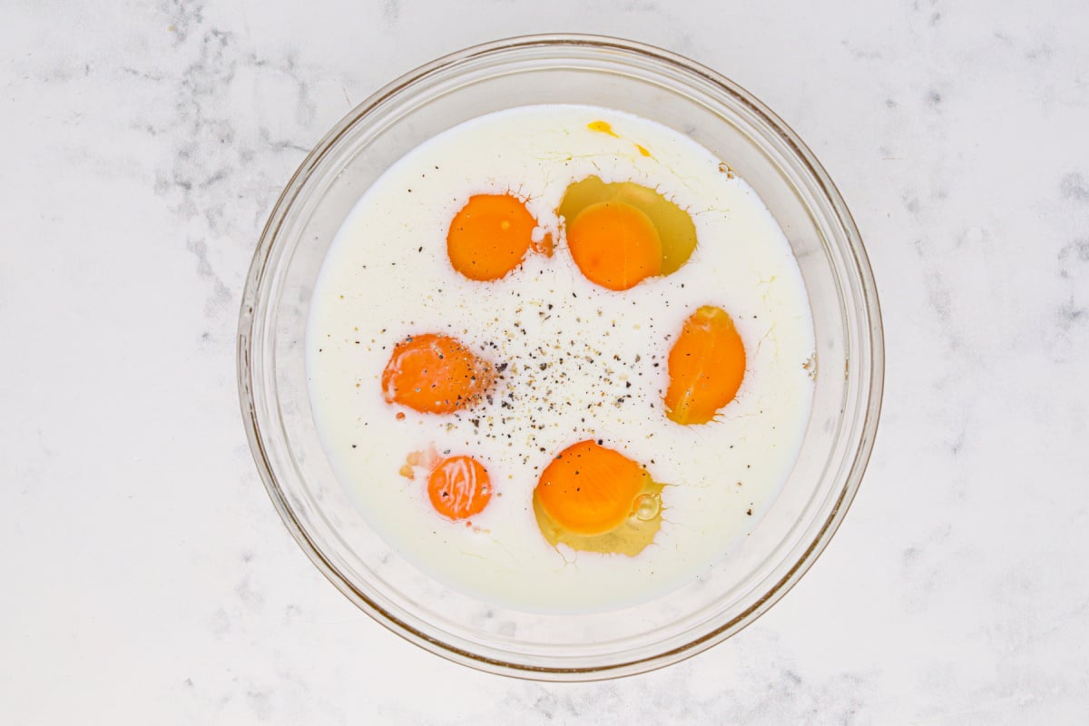 eggs, milk and salt and pepper in a bowl