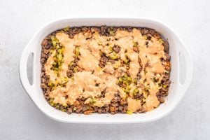 pickles and sauce added to top of beef mixture