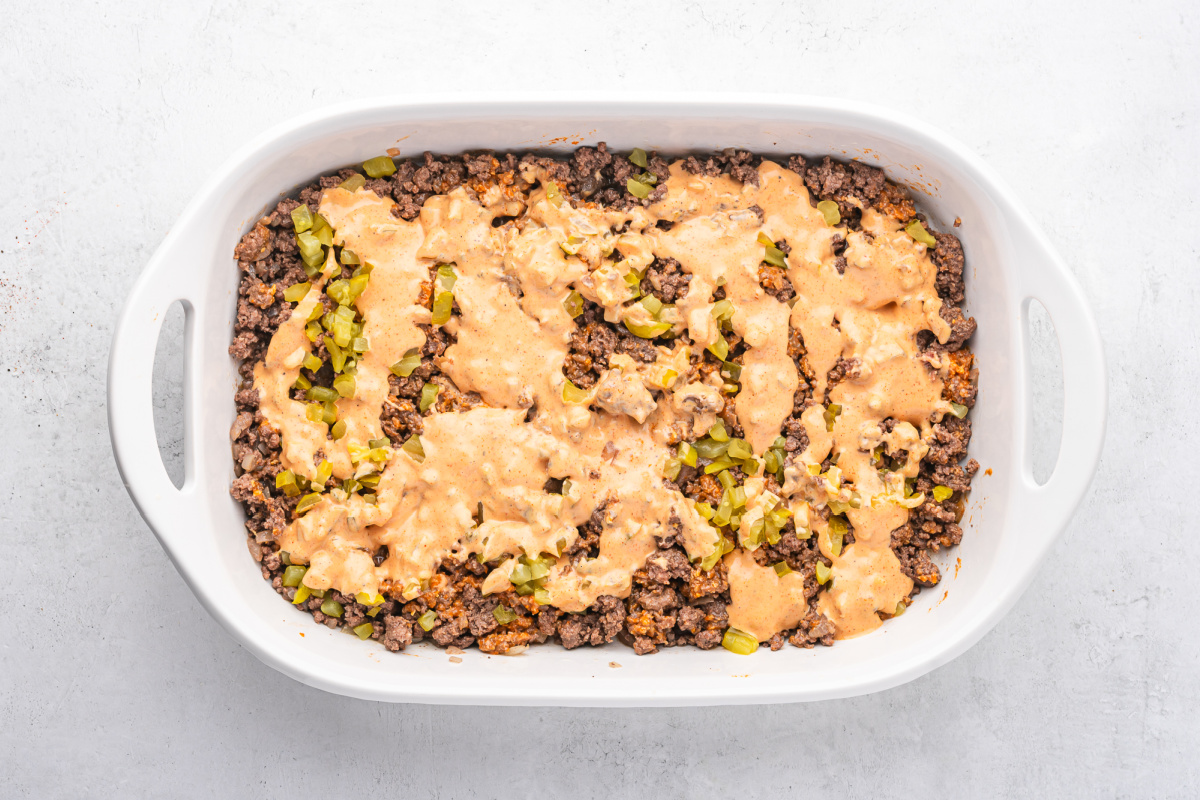 pickles and sauce added to top of beef mixture