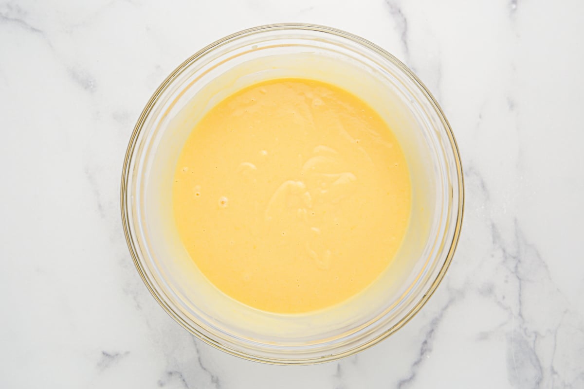 vanilla pudding, sweetened condensed milk and cold milk in a bowl
