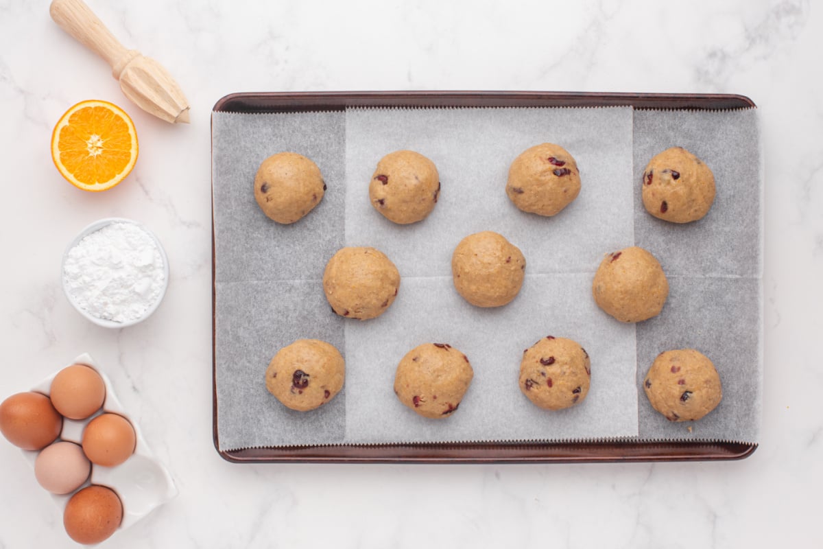 dough rolled into balls and placed on baking sheet