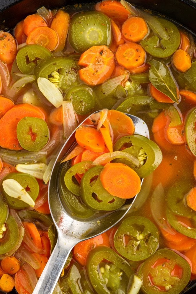 Taqueria style pickled jalapeno and carrots in a pan