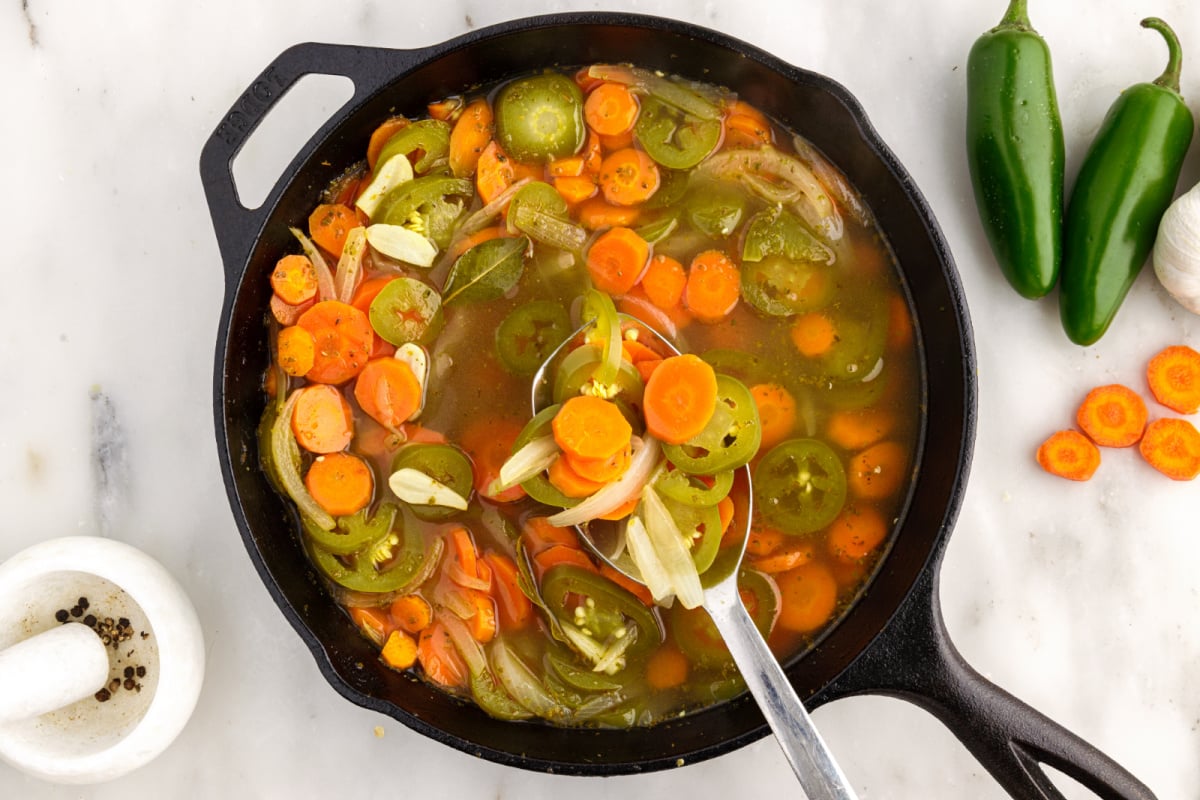 Taqueria style pickled jalapeno and carrots in a pan