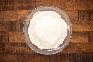 greek yogurt and flour in a bowl