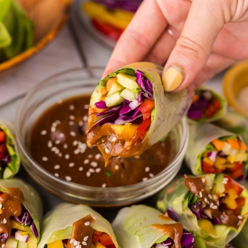 Vegetable spring rolls holding peanut butter
