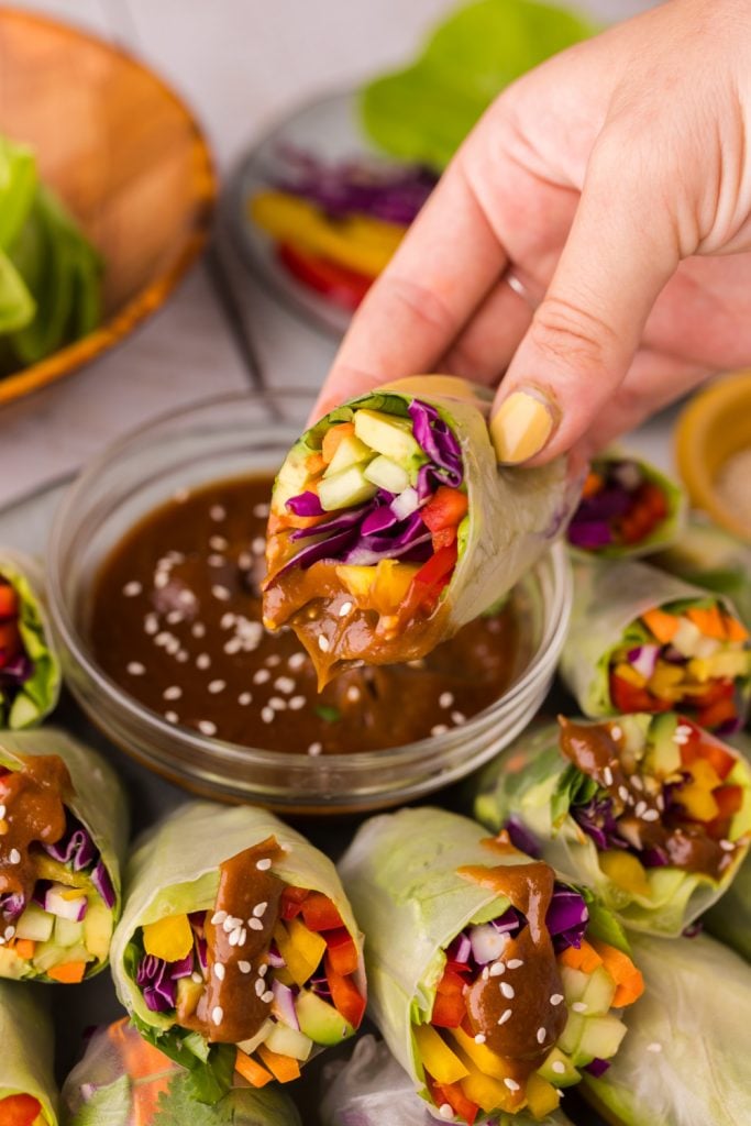 Vegetable spring rolls holding peanut butter