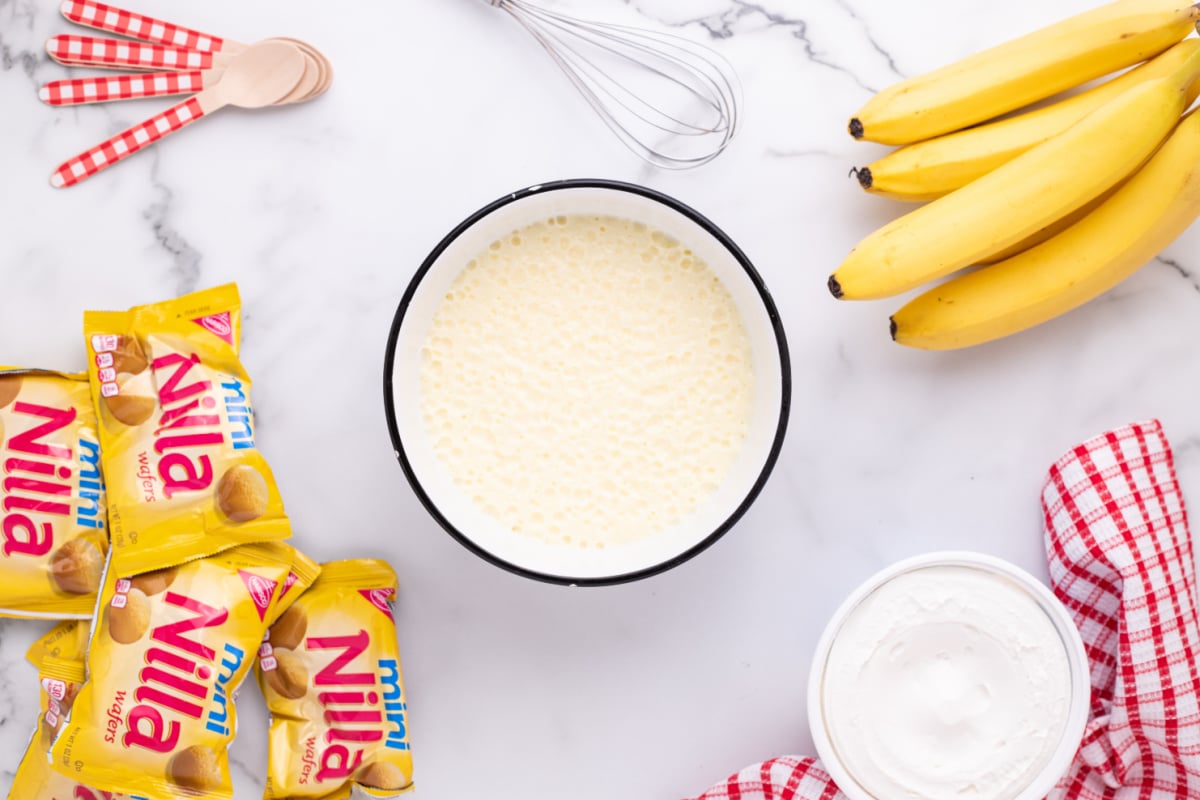 milk and banana pudding mixed in a bowl