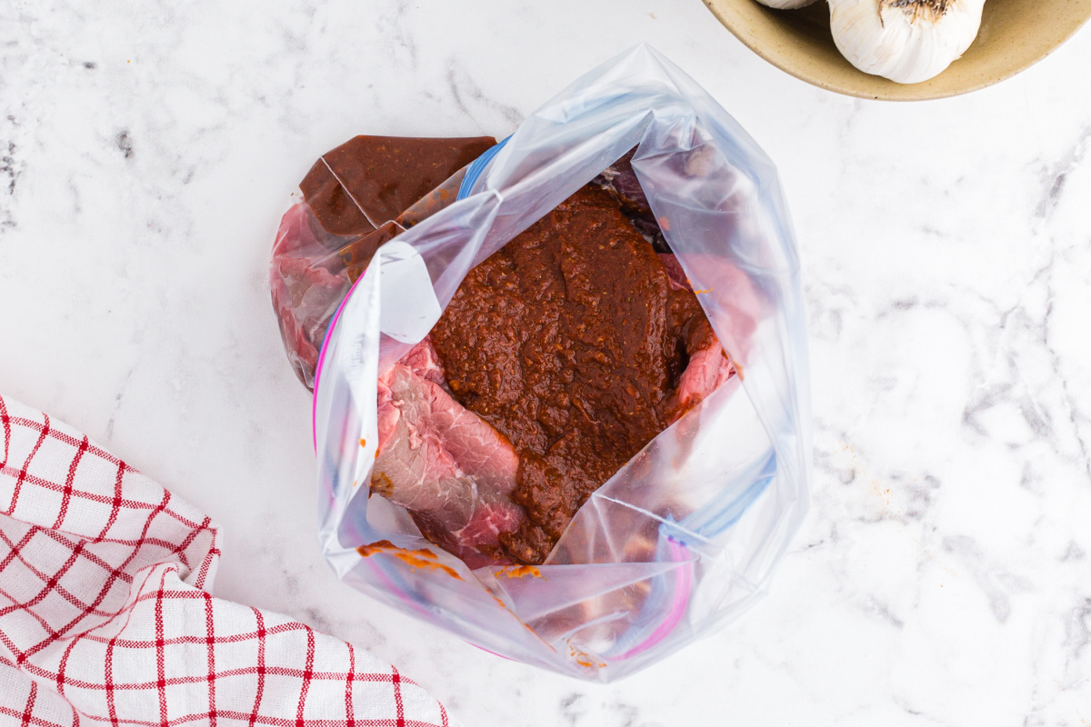 steak in a storage bag with marinade