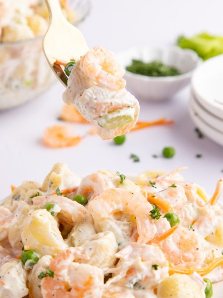 Mermaid Shrimp Pasta Salad in a bowl with a fork picking up some