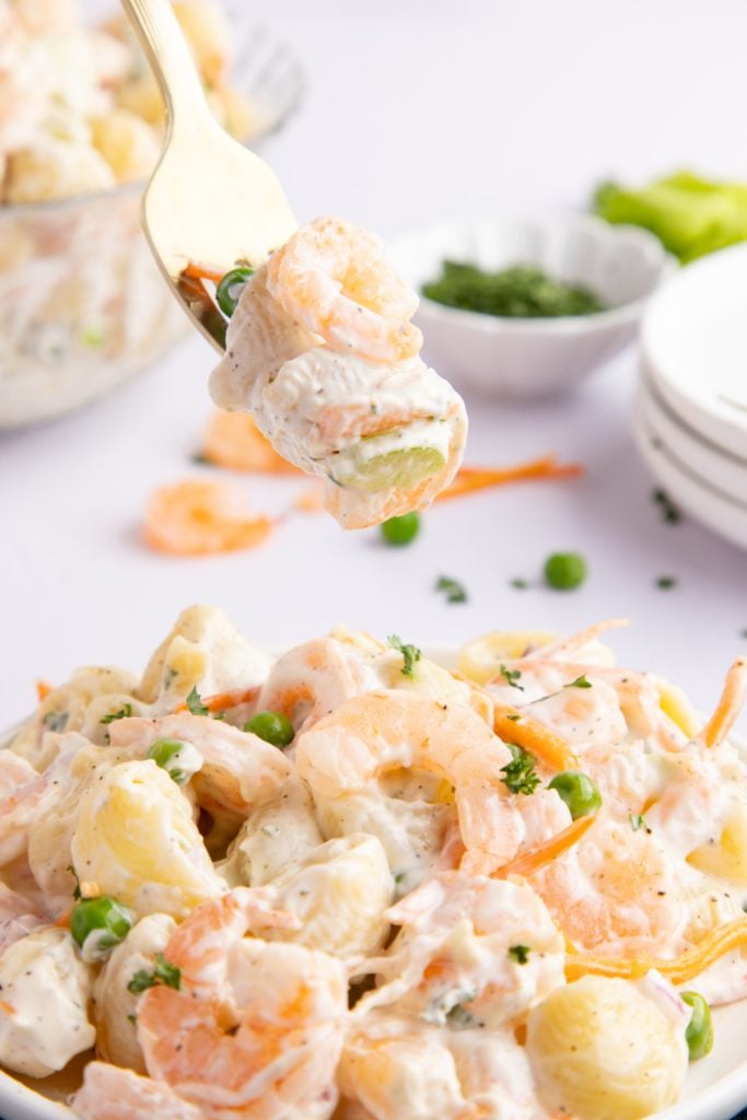 Mermaid Shrimp Pasta Salad in a bowl with a fork picking up some