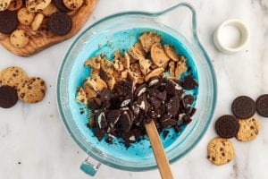 cookie pieces placed in ice cream mixture