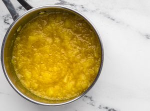 crush pineapple added to pot