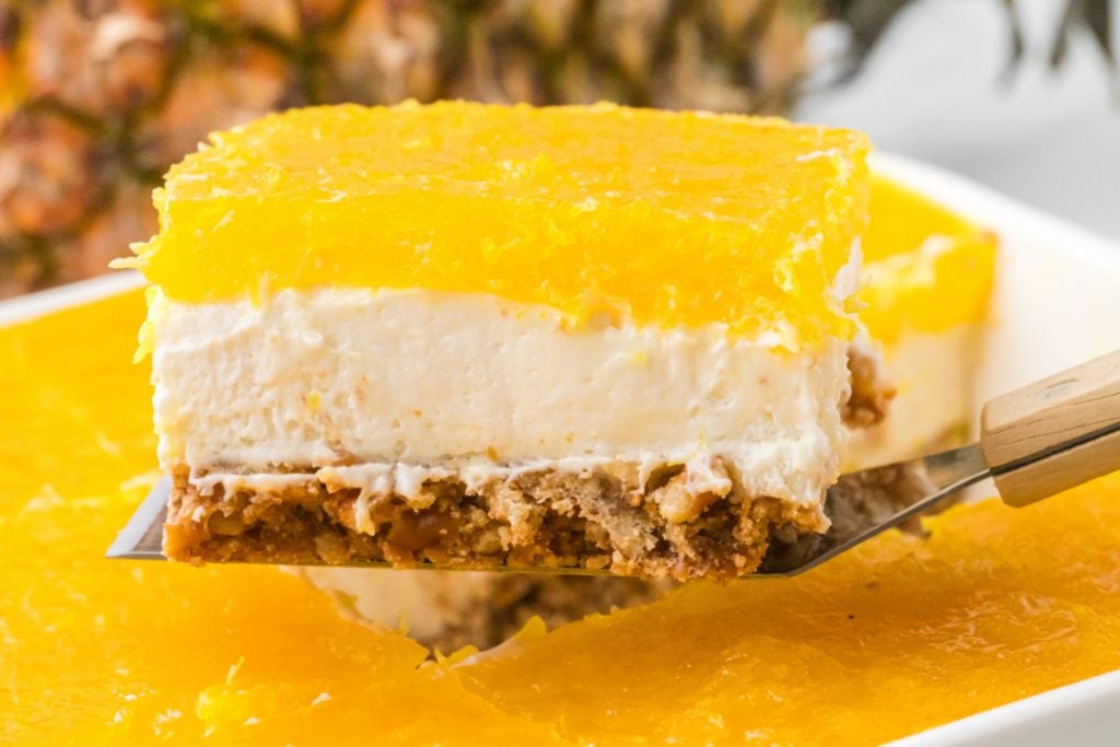 Pineapple Pretzel Salad Dessert on a spatula 