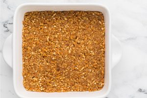 pretzel crust placed into baking pan