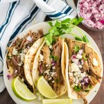 Slow Cooker Barbacoa Beef Tacos on a plate