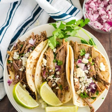 Slow Cooker Barbacoa Beef Tacos on a plate