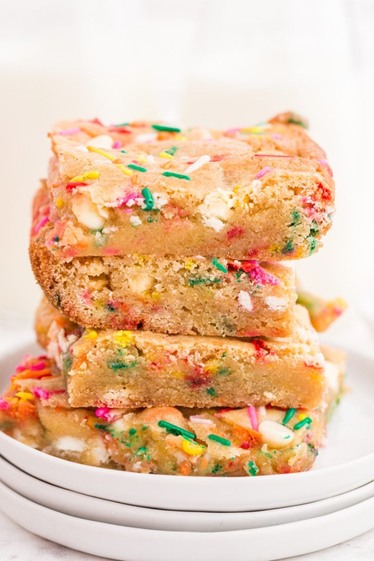 Birthday Cake Blondies stacked on a plate