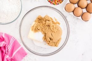 butter, sugar, and brown sugar in a bowl