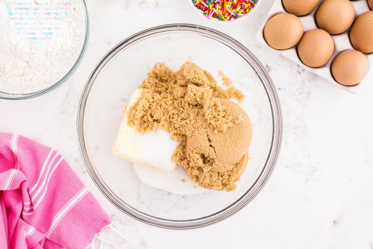 Butter, sugar and brown sugar in a bowl