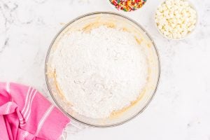 adding flour mixture to bowl