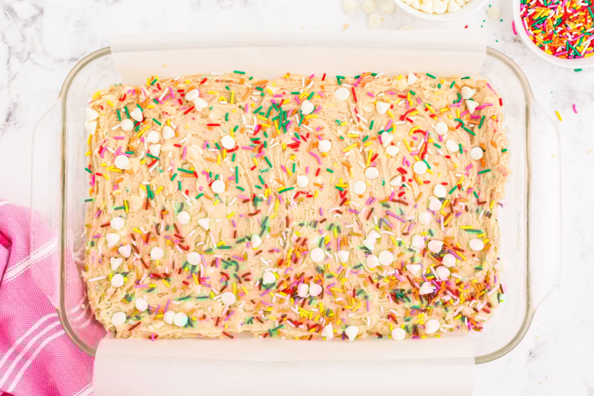 Sprinkle water and chocolate chips on top of the batter
