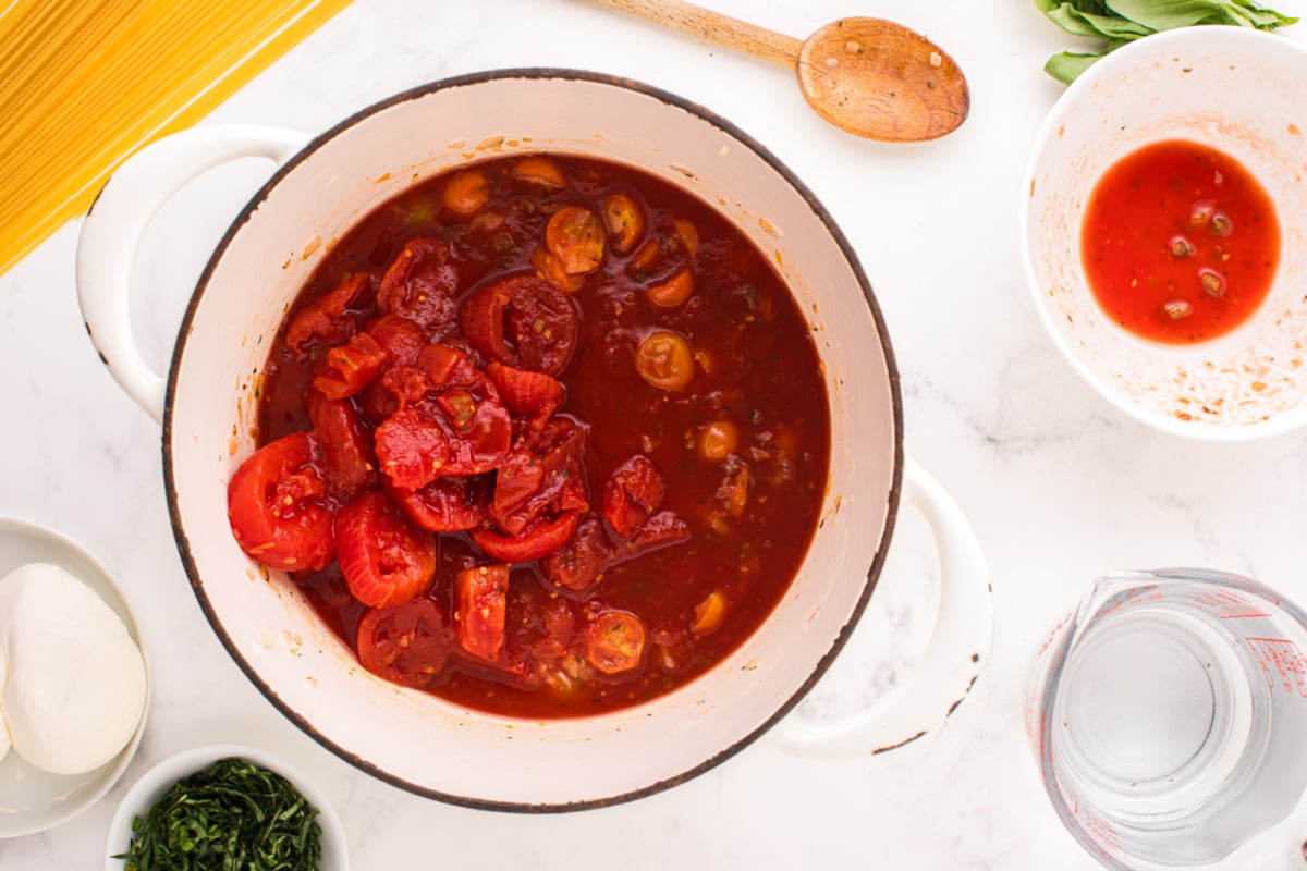 Italian style stewed tomatoes to the pot
