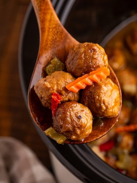 Slow Cooker Chicago Style Meatballs on a wooden spoon