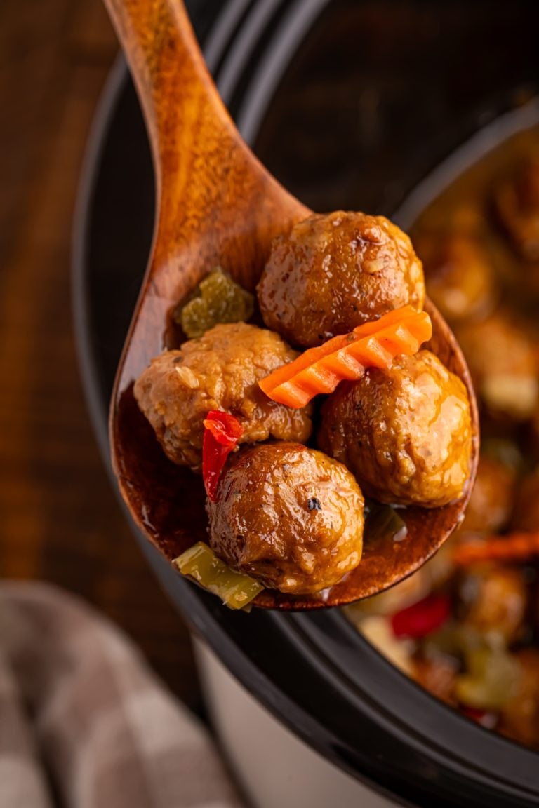 Slow Cooker Chicago Style Meatballs on a wooden spoon