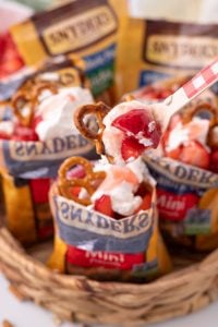 spoon scooping out some Walking Strawberry Pretzel Salad Dessert