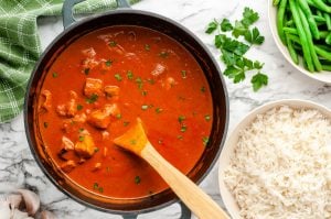 chicken cooking in sauce