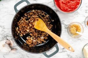 diced onions cooking in pan