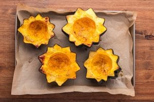 roasted acorn squash on a baking sheet
