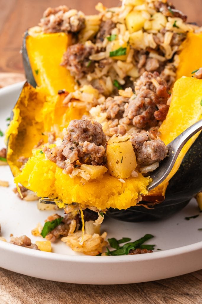 Sausage Stuffed Acorn Squash cut in half