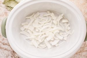 sliced onion in slow cooker