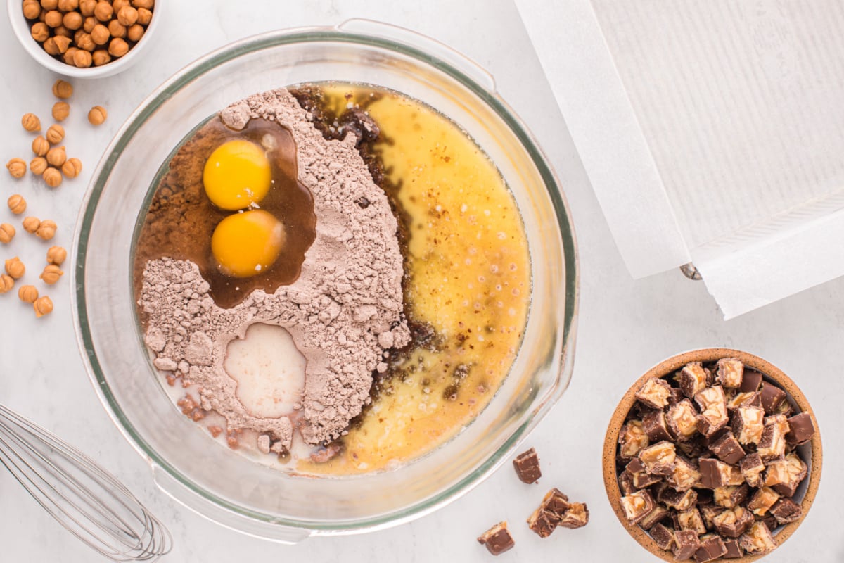 Brownie mixture, eggs, butter and milk in a bowl