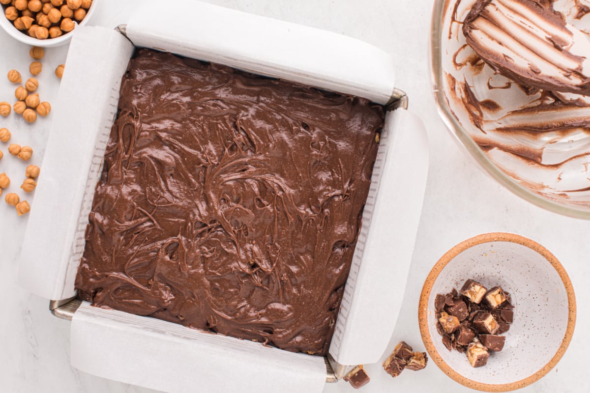 Brownie batter added to candy slices