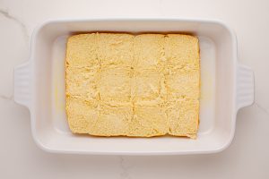 bottom half of rolls placed in baking pan
